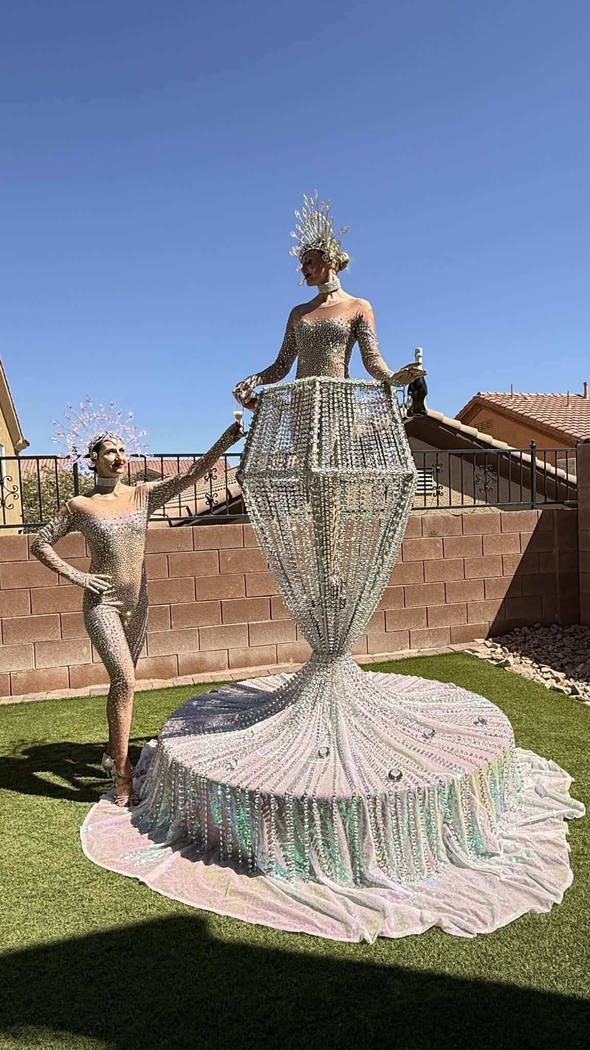 Performer pouring champagne from the diamond tower