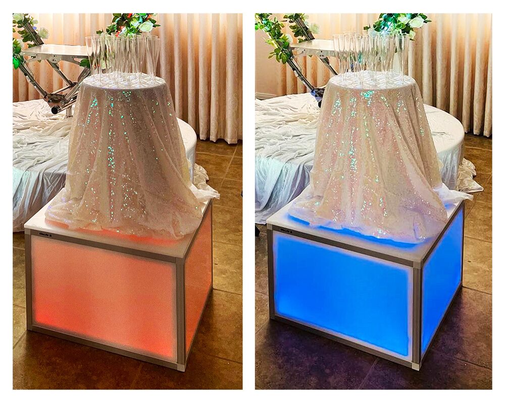 Draped serving tables on glowing LED boxes