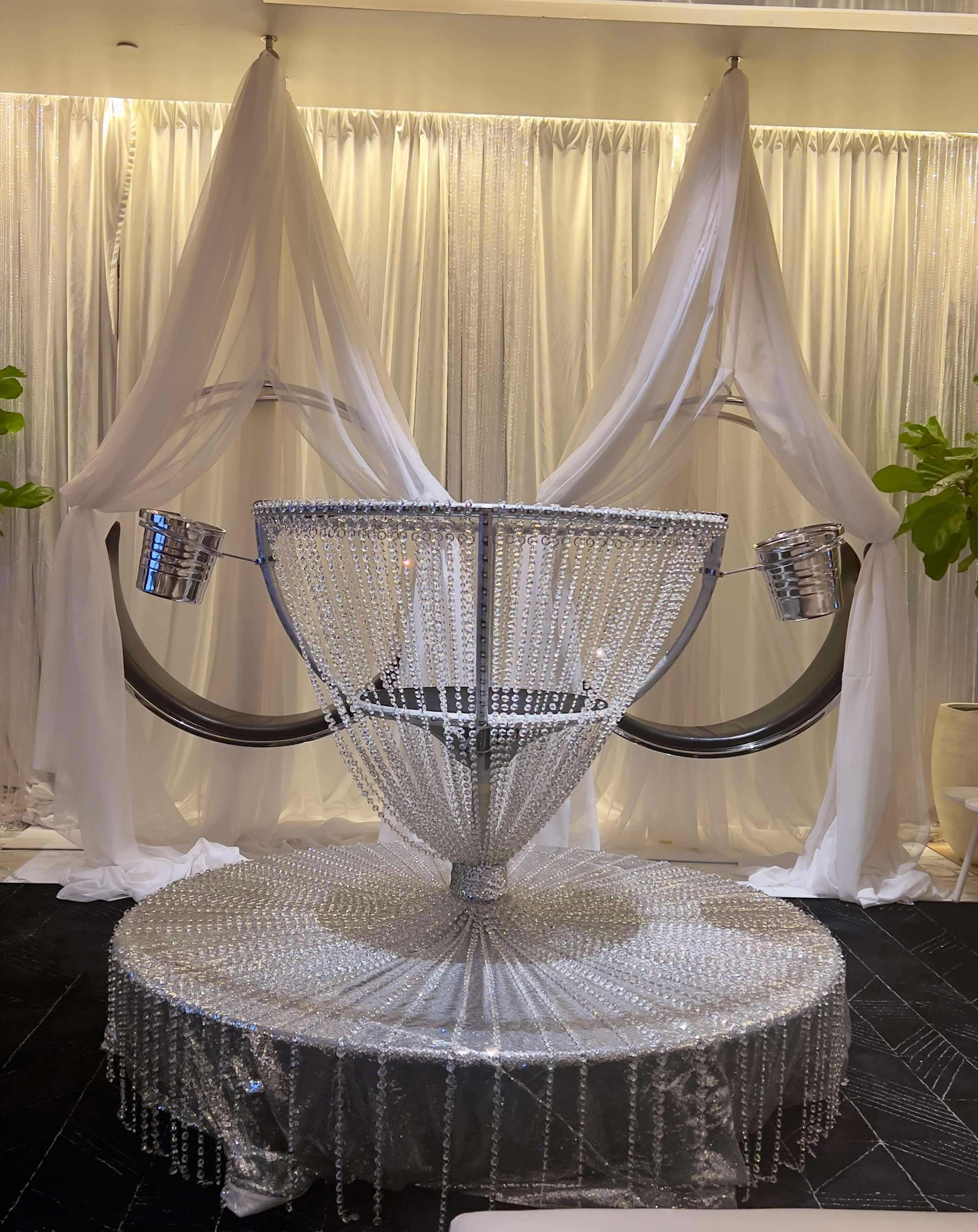Crystal martini glass with white drape canopy